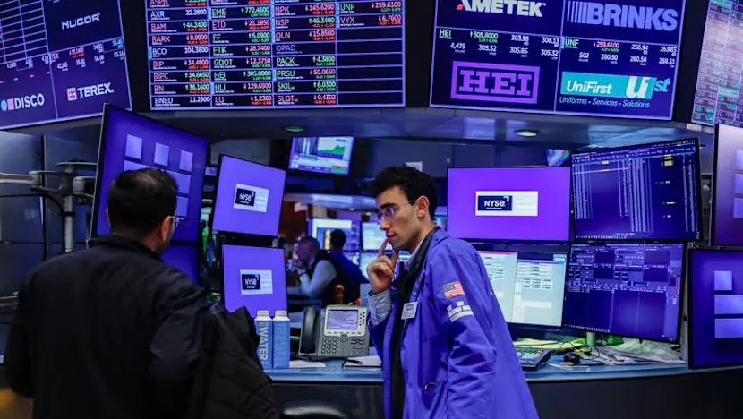 Financial screens displaying stock indexes, currency rates and bond yields