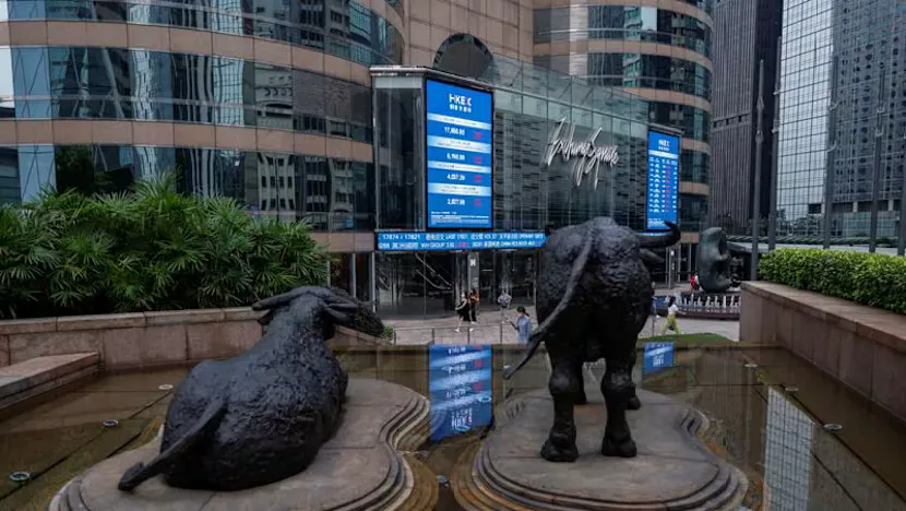 Financial screens displaying equity indices, bond yields and currency prices