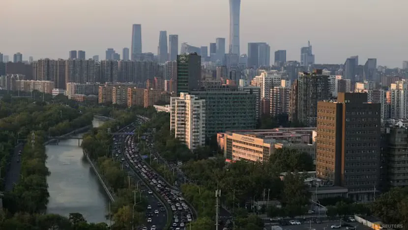 Buildings and construction cranes along an urban skyline in China