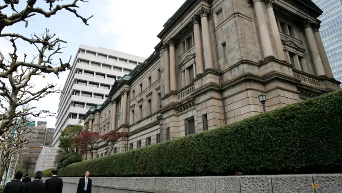 Japanese yen banknotes beside a chart of interest rates