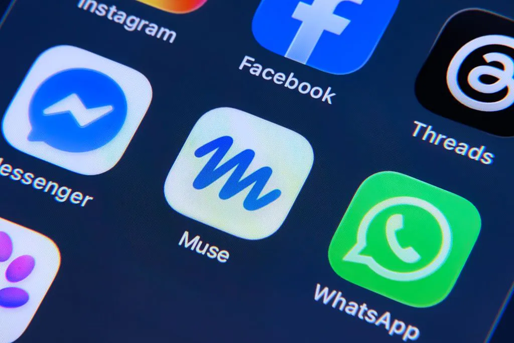 Smartphone displaying an AI chat interface beside mobile app icons