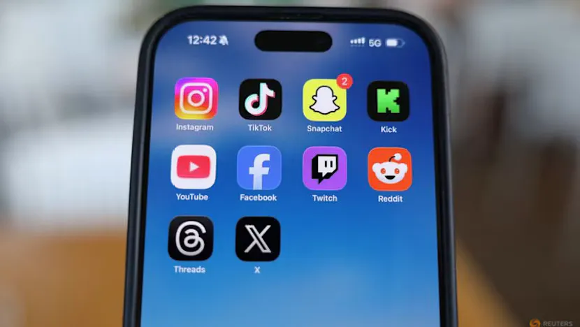 Smartphone displaying social media icons beside an age-verification screen