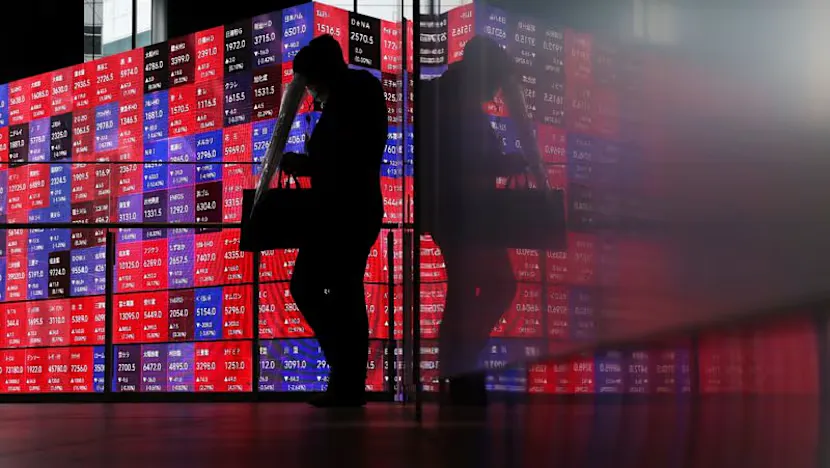 Financial market screens displaying stock indexes, oil prices and bond yields