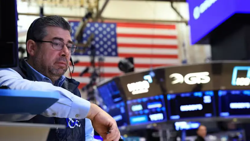 Financial market screens displaying stock indexes, bond yields and oil prices