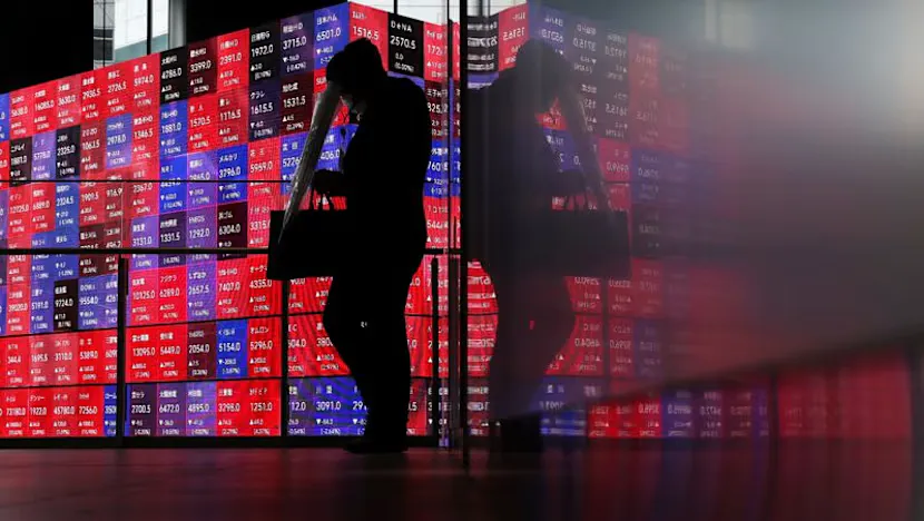 Financial trading screens displaying European stock indices and currency quotations