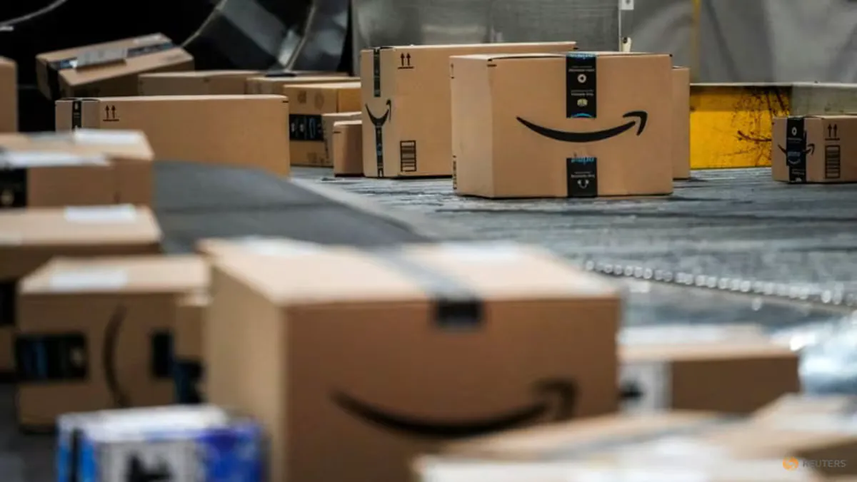 Packages moving along a conveyor belt inside a warehouse