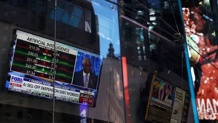 Stock market screens displaying technology share prices and index charts