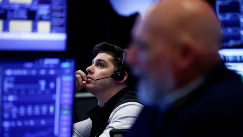 Financial screens displaying equity indices, bond yields and commodity prices