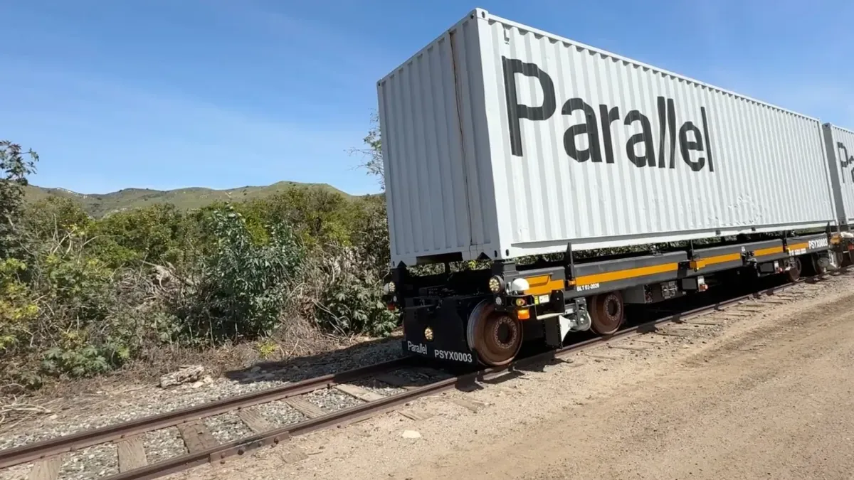 Freight rail tracks and cargo containers at a shipping terminal