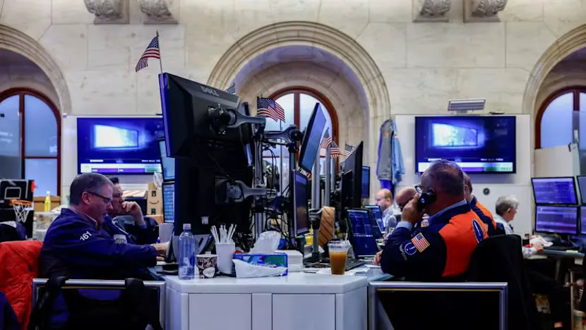 Financial trading screens displaying equity indices, currency rates and government bond yields