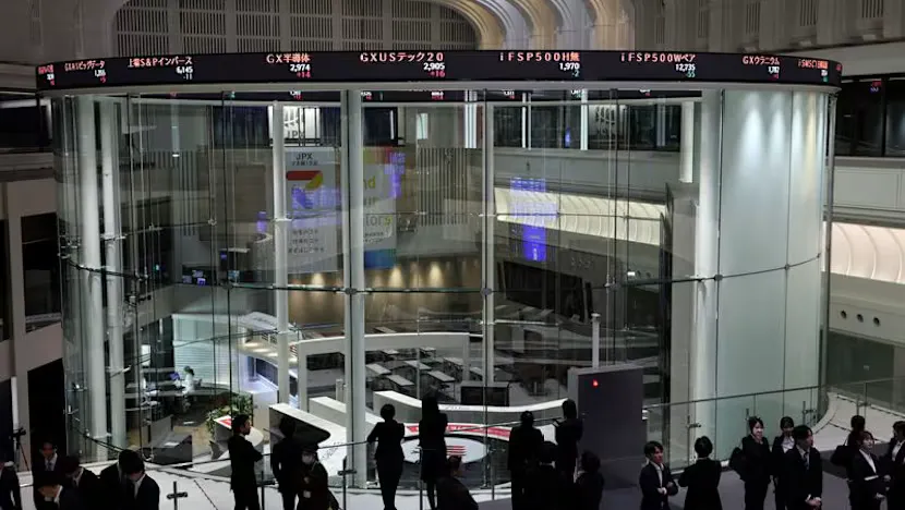 Financial market screens displaying stock indices, bond yields and currency rates