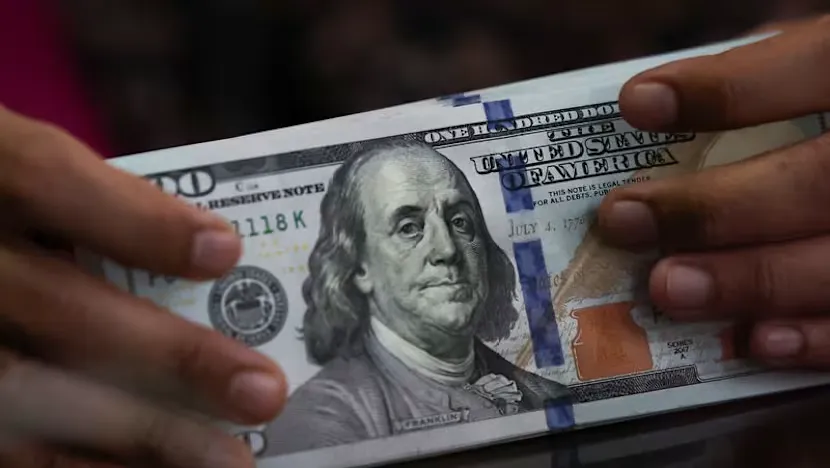 Currency trading screens displaying exchange rates and bond yields