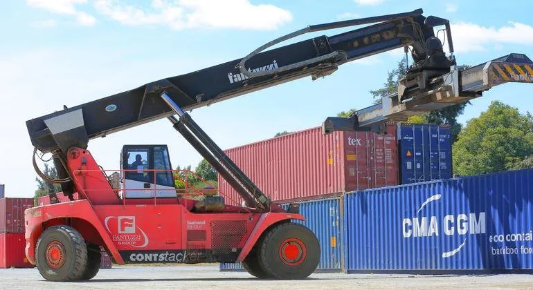 Shipping containers stacked at a cargo port