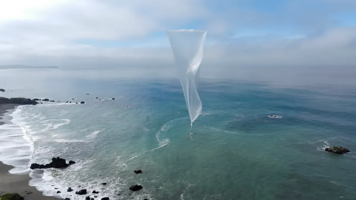 Weather balloon carrying atmospheric sensors above the clouds