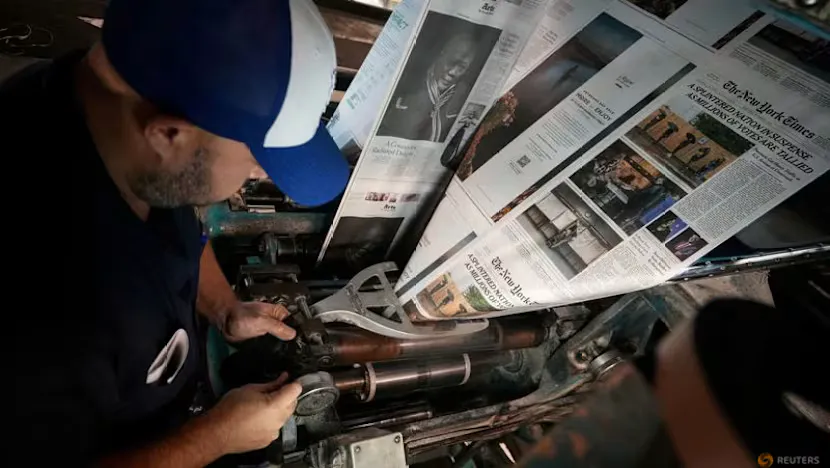 Digital news pages displayed beside an illustration of an artificial intelligence network
