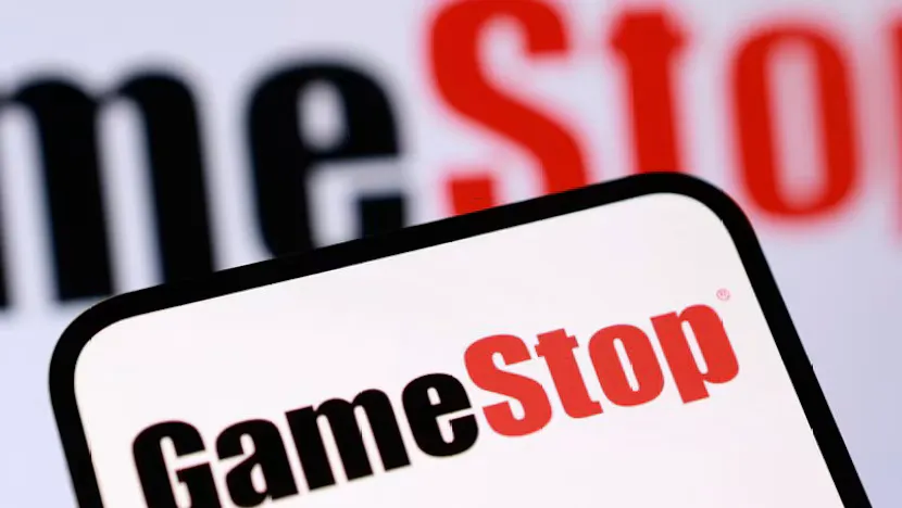 Video game cases displayed on shelves in a retail store