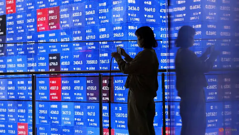 Financial market screens displaying stock indices and government bond yields