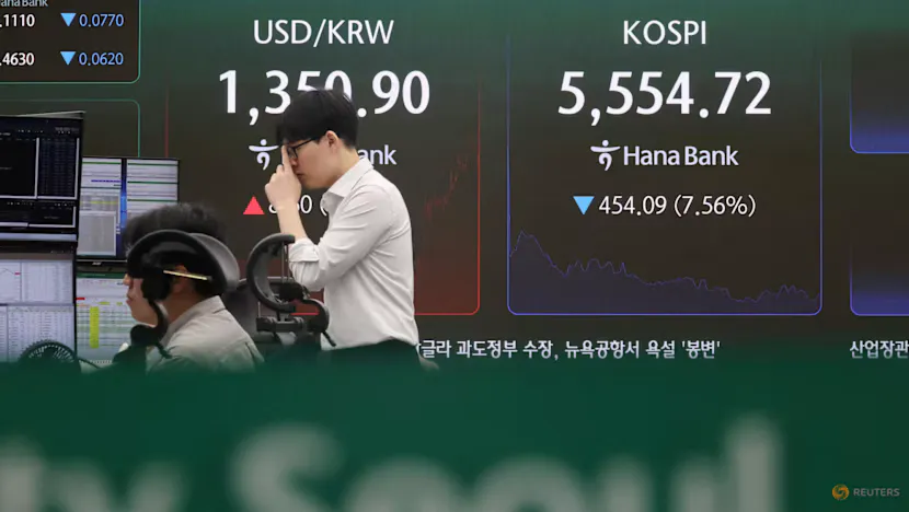 Electronic market boards displaying Asian stock indices and share prices